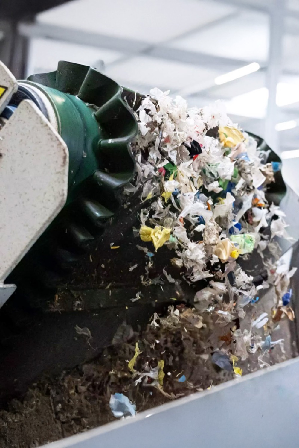 Auger processing de-packaged shredded plastic waste at AD plant