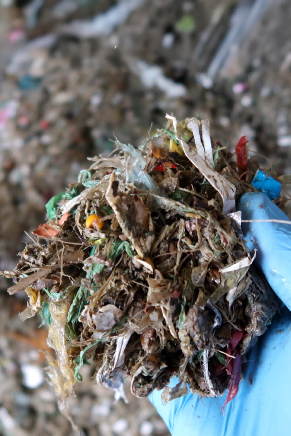Close-up of mixed de-packaged plastic waste showing variable composition