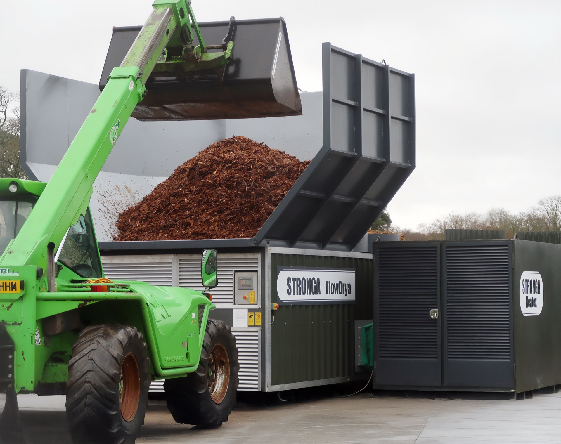 Wet bark being loaded into the FlowDrya